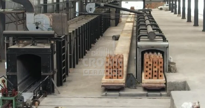 Kiln cars loaded with bricks at the tunnel kiln entrance