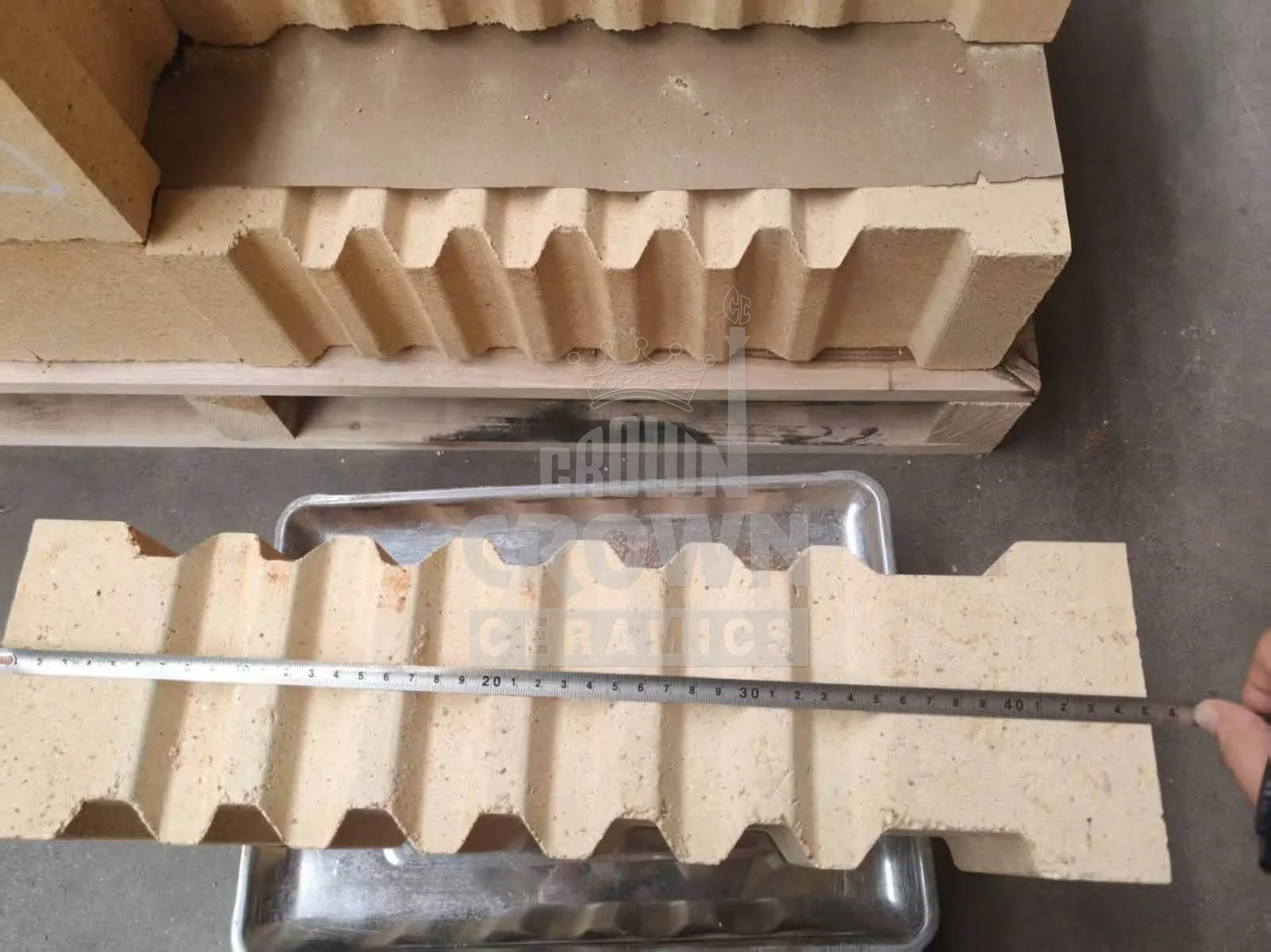Anchor tile being measured for dimensional check
